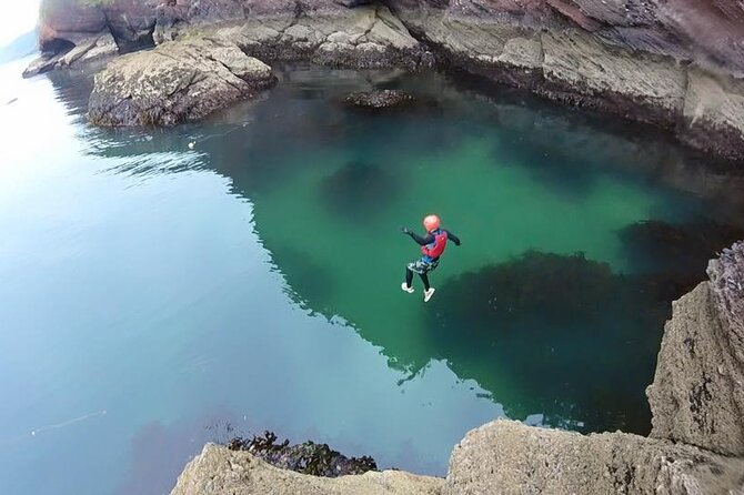 Coasteering Geopark Adventure In Torquay - Jumps into clear water, with no forced heroics